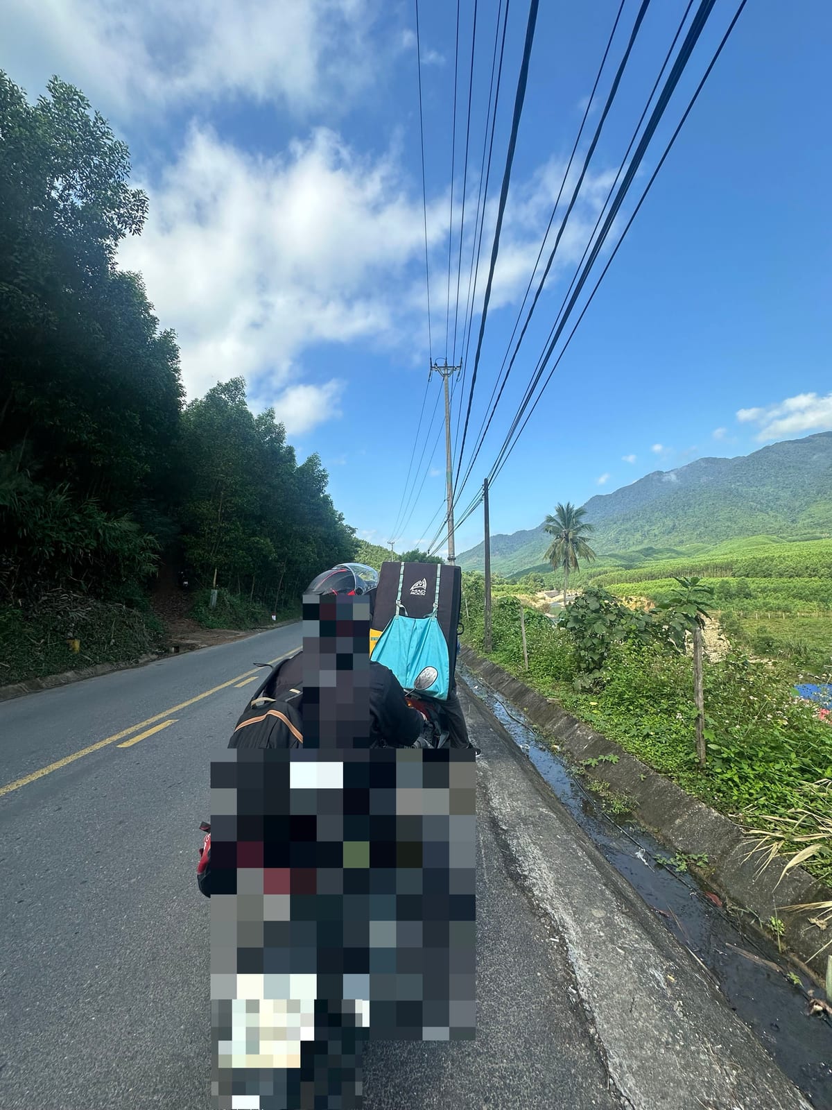Crash pad strapped to the back of a motorbike on the way to the boulders in Da Nang, Vietnam