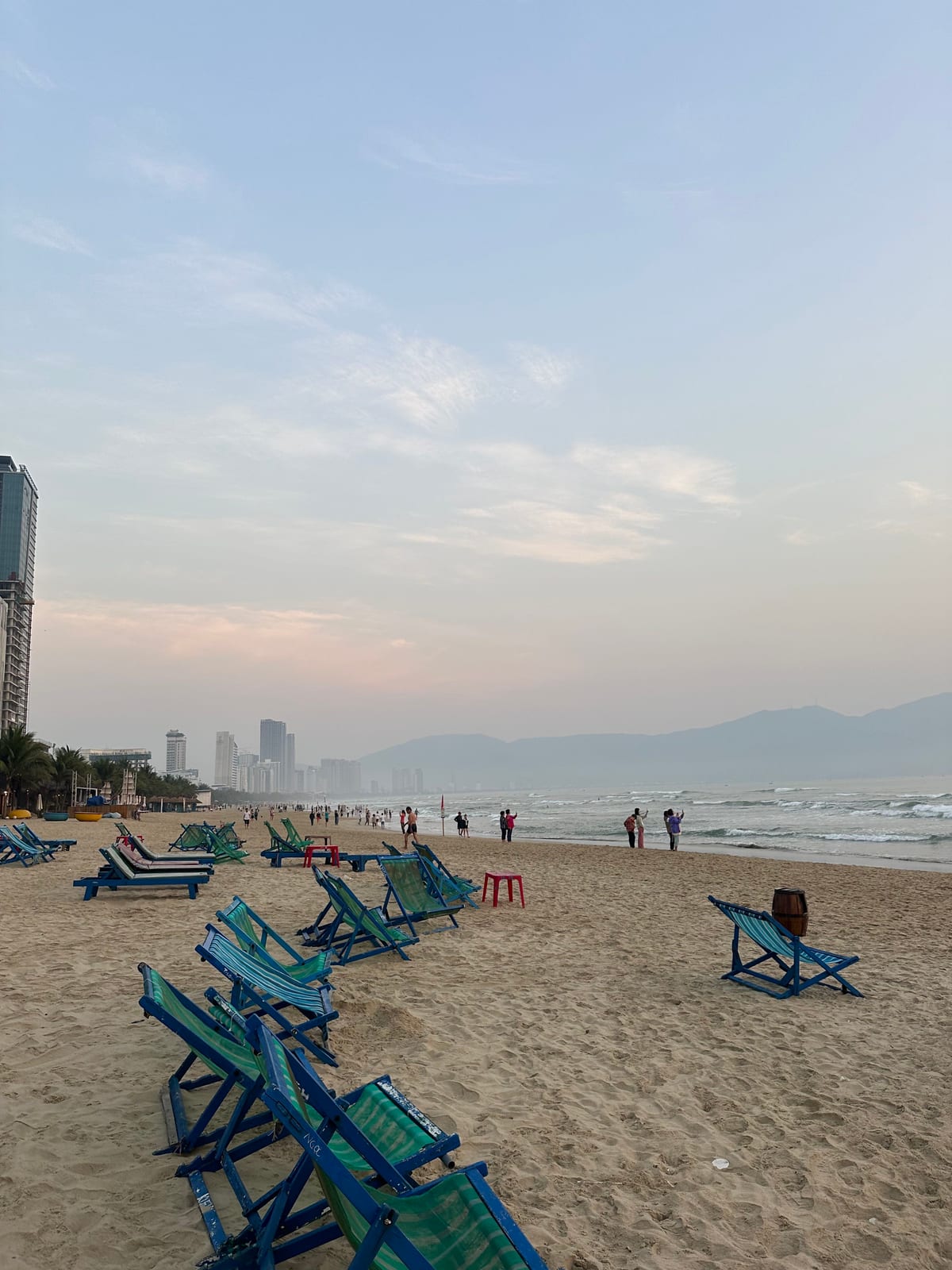 Sunset over My Khe beach with the Son Tra peninsula in the distance, Da Nang