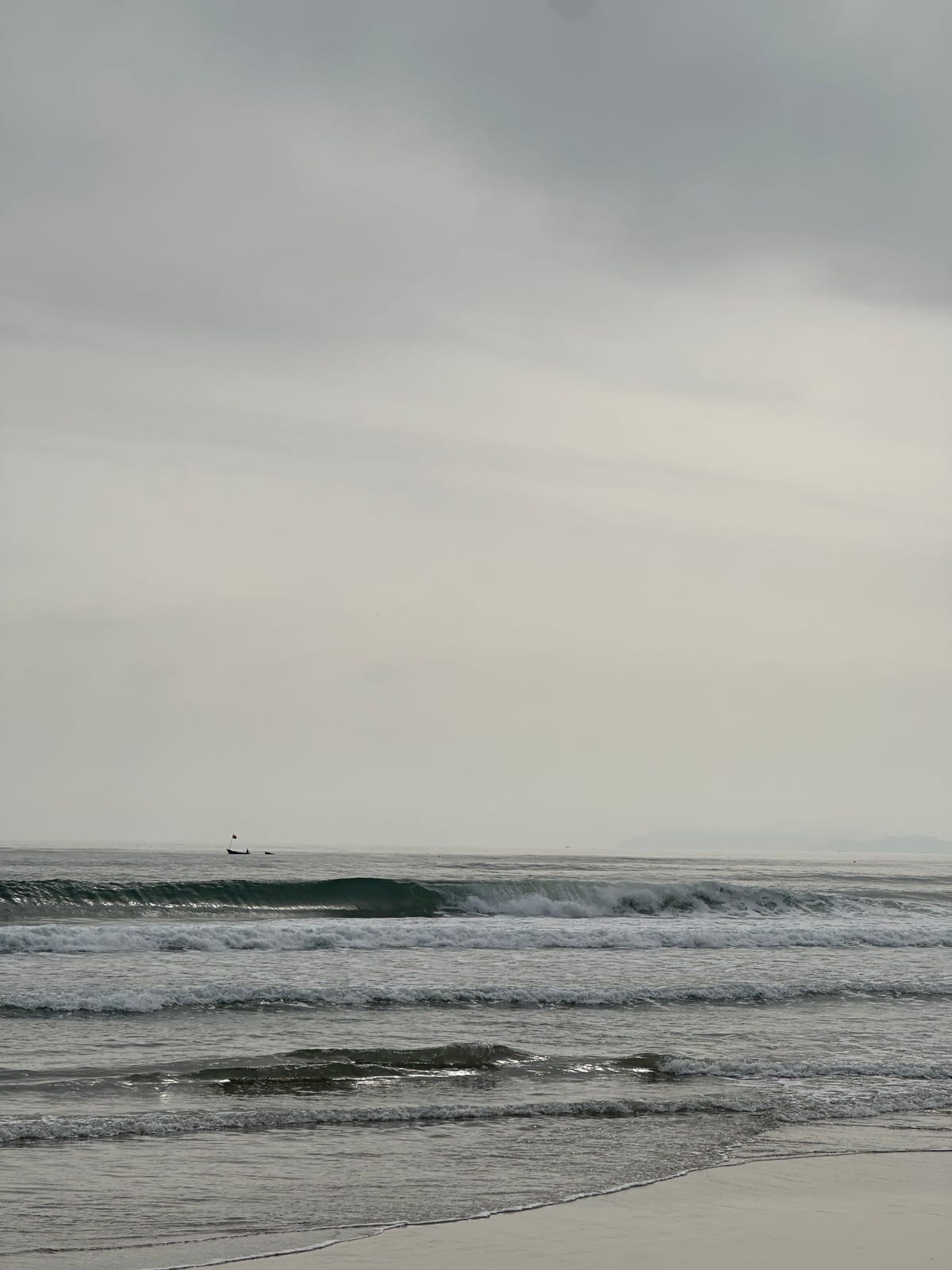 Clean waves breaking at My Khe beach in Da Nang, Vietnam