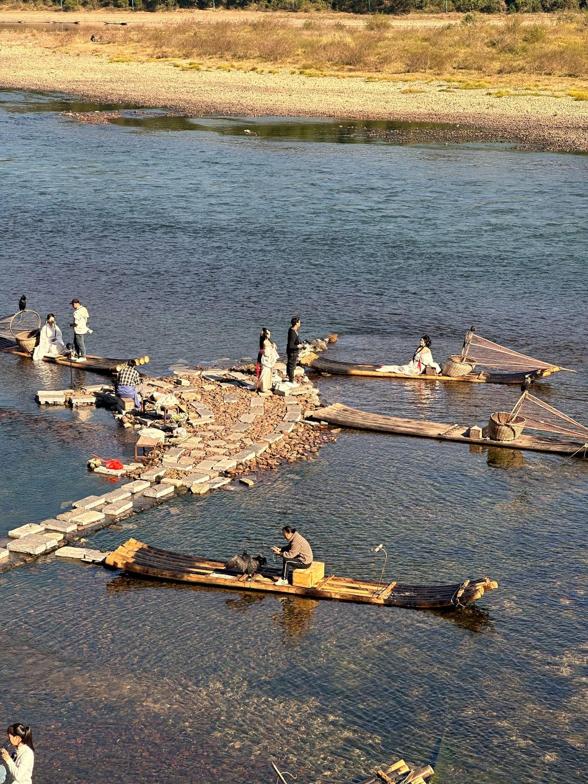 Bamboo rafts and river activities on the water near Yangshuo