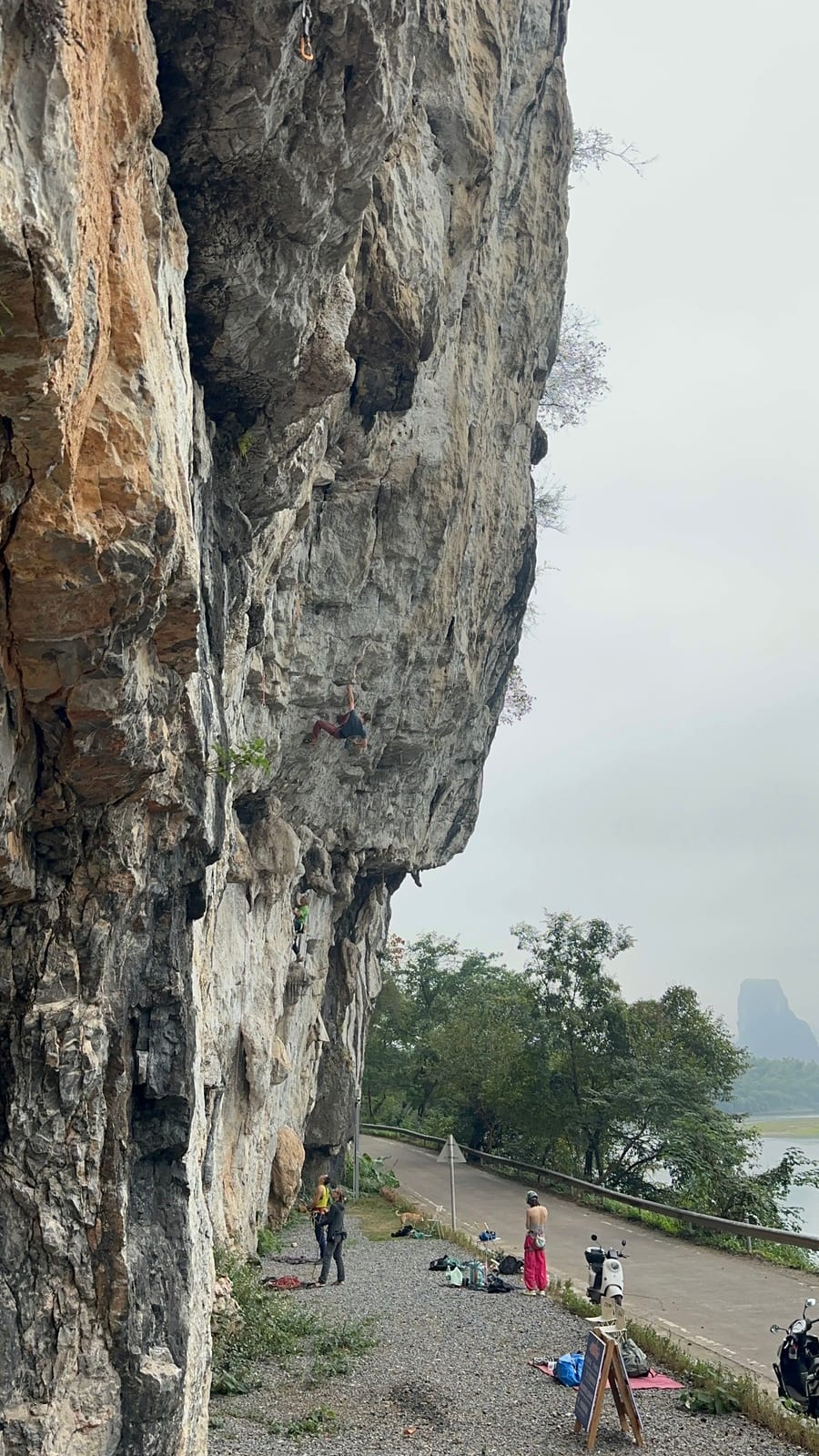 Riverside crag in Yangshuo, a tall limestone wall above the river