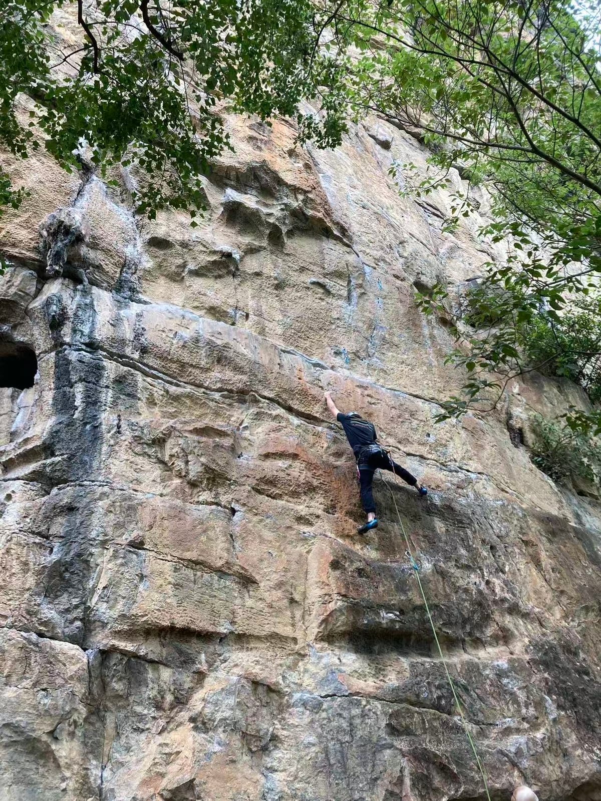 Climbers on the East Wall at Twin Gates crag, Yangshuo, China