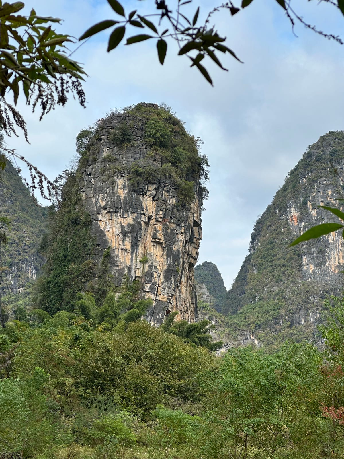 Karst tower above the approach to Twin Gates crag, Yangshuo, China