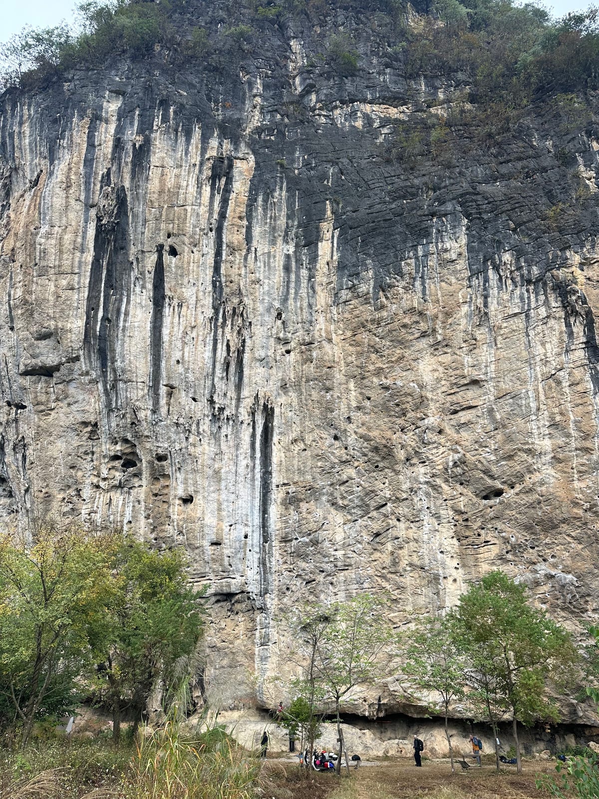 The striped limestone wall of White Mountain crag in Yangshuo, China