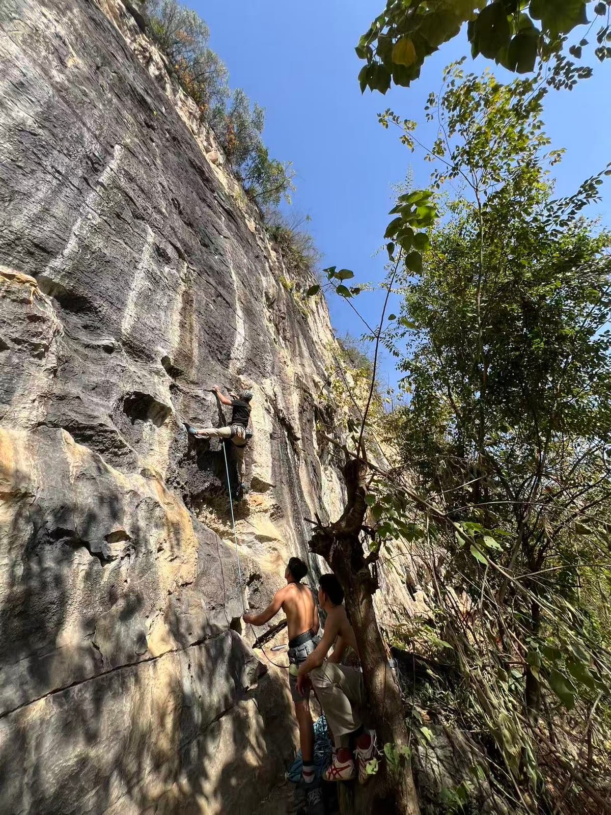 The belaying area at the base of Wine Bottle crag, Yangshuo